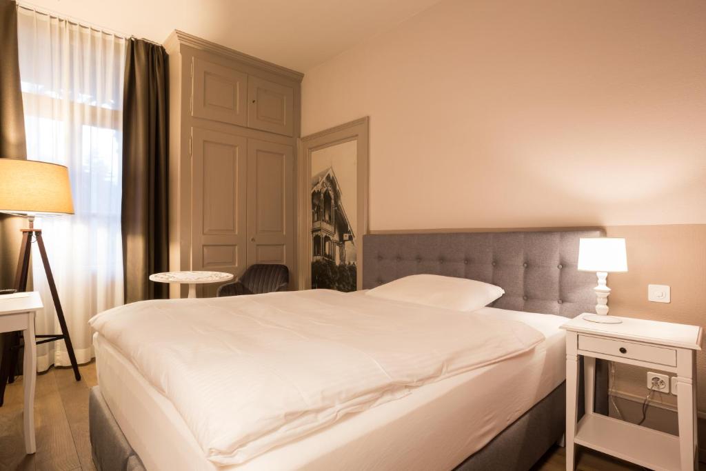 Letto o letti in una camera di Hotel Emmental