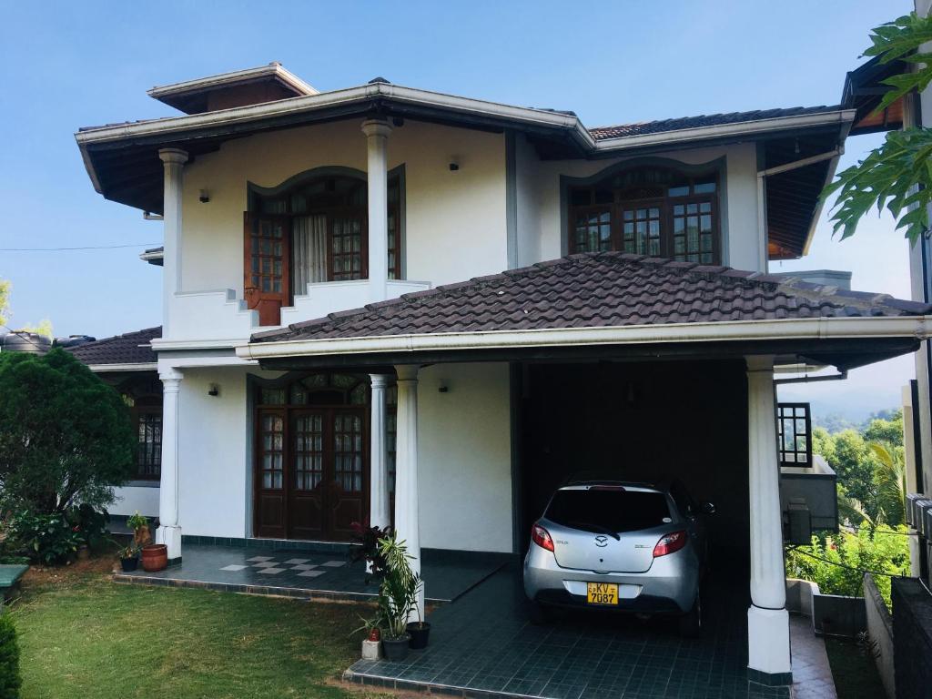 a car parked in the garage of a house at Arcadia House Hanthana in Kandy