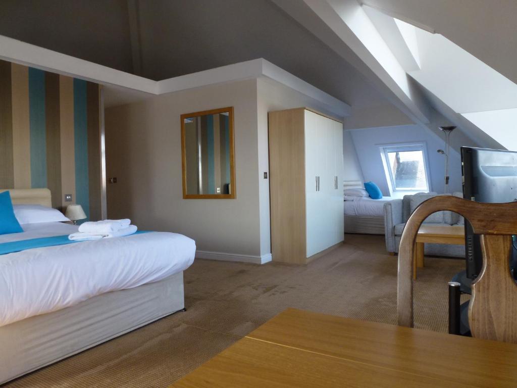 Postel nebo postele na pokoji v ubytování Boathouse Hotel