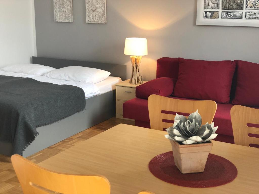Postel nebo postele na pokoji v ubytování Apartments Rombon
