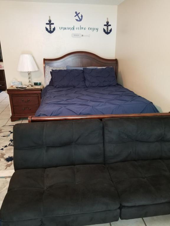 a bed in a room with a large mattress at Beach More Worry Less in Tampa