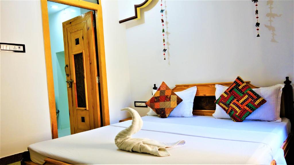 Postel nebo postele na pokoji v ubytování The Wanderlust Guest House & Safari