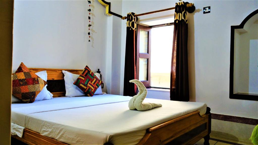 Postel nebo postele na pokoji v ubytování The Wanderlust Guest House & Safari