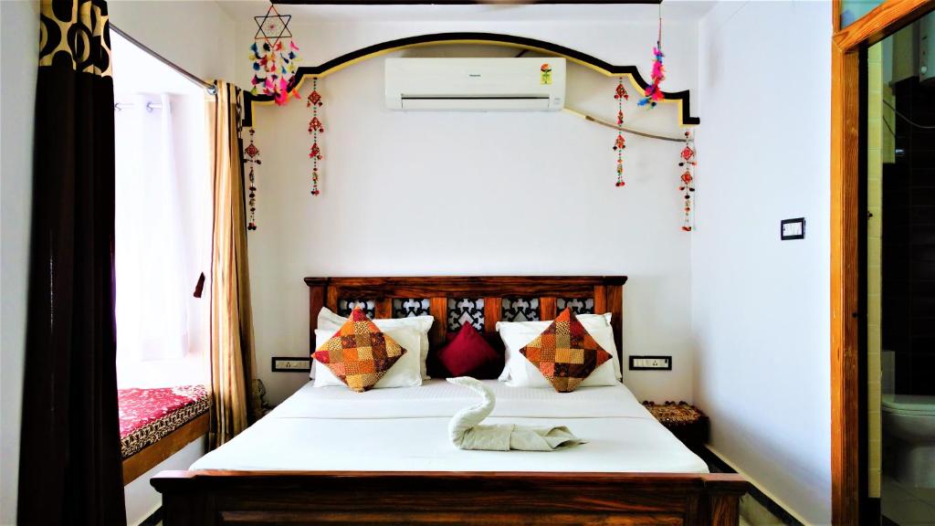 Postel nebo postele na pokoji v ubytování The Wanderlust Guest House & Safari