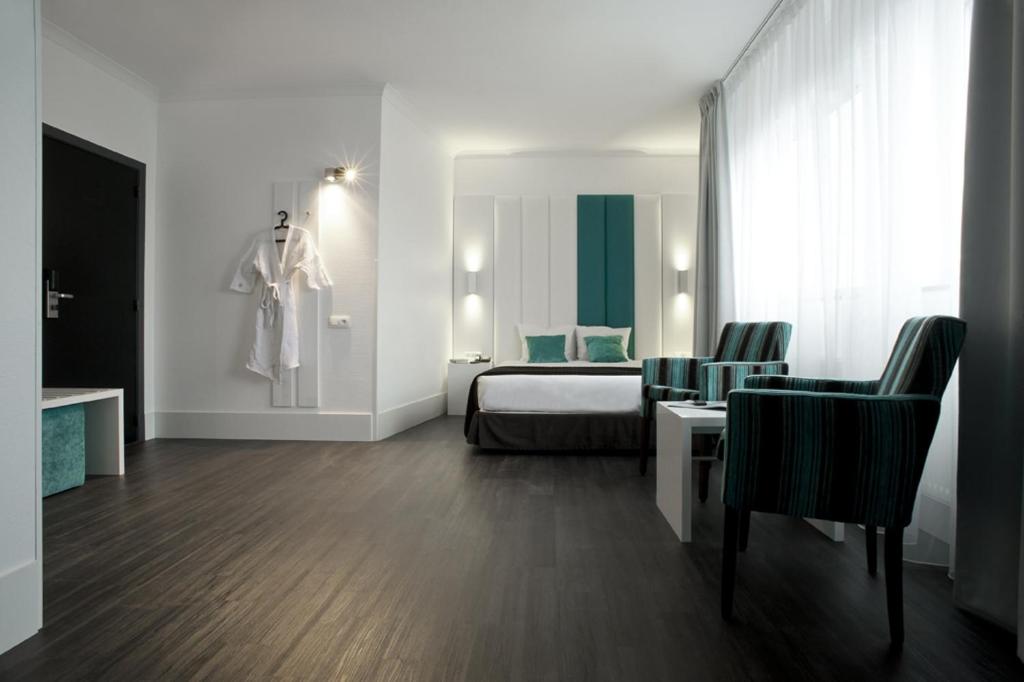 Postel nebo postele na pokoji v ubytování Hotel Ecu