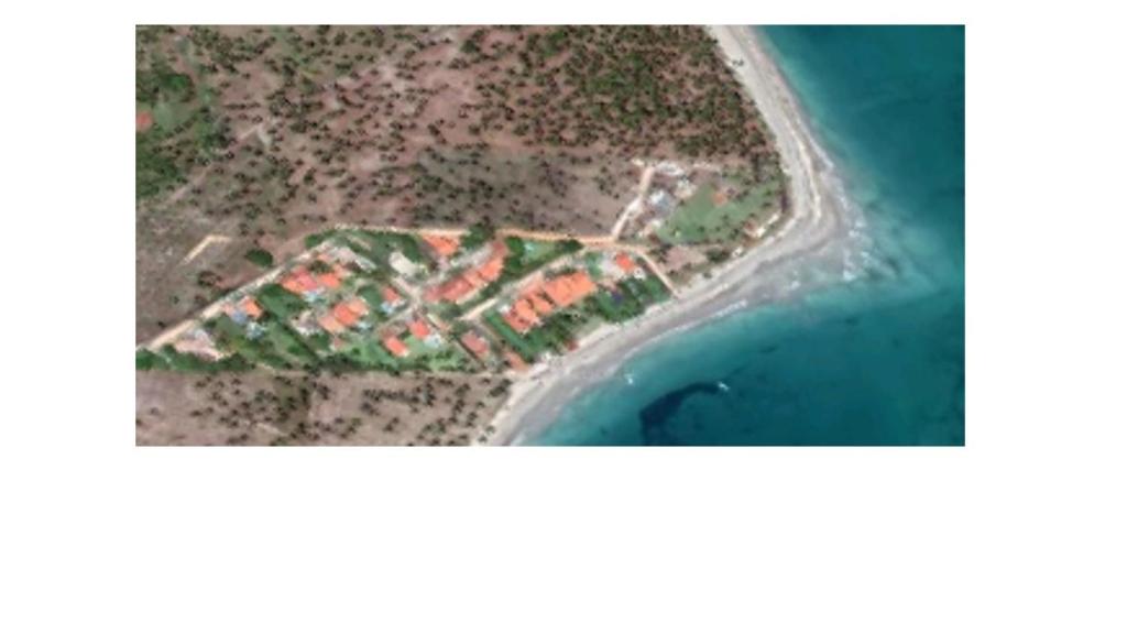 an aerial view of an island in the ocean at Casa Praia dos Carneiros in Tamandaré