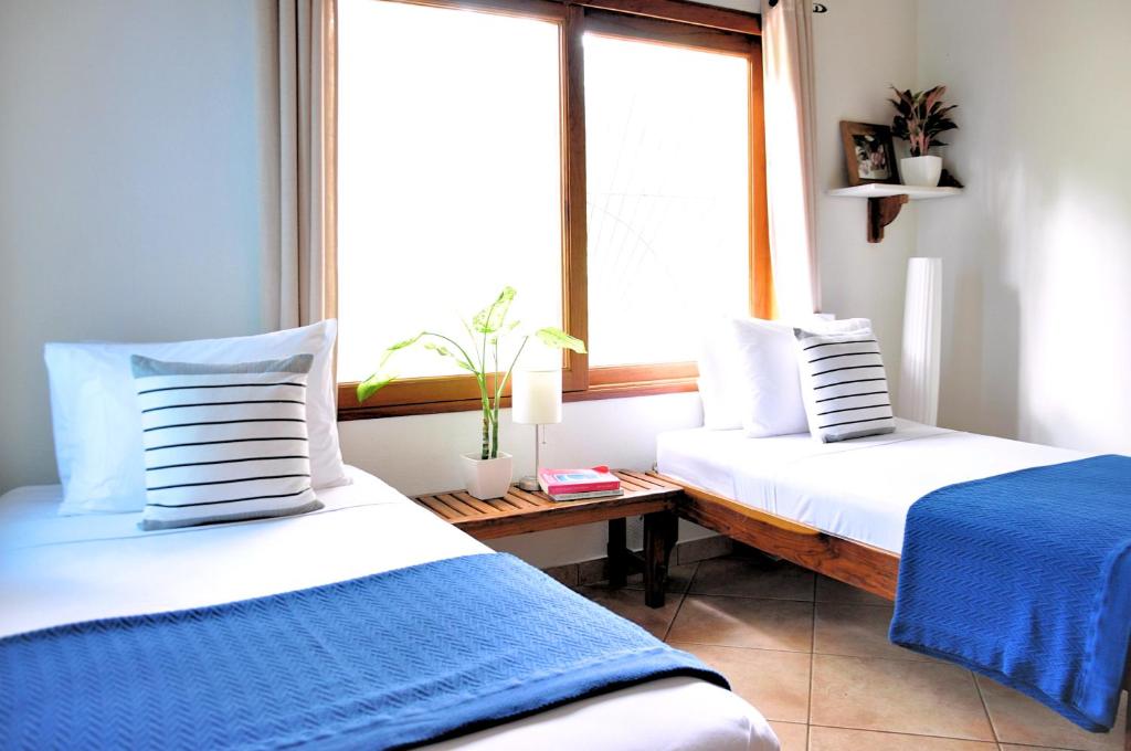 Postel nebo postele na pokoji v ubytování Pazifico Villas