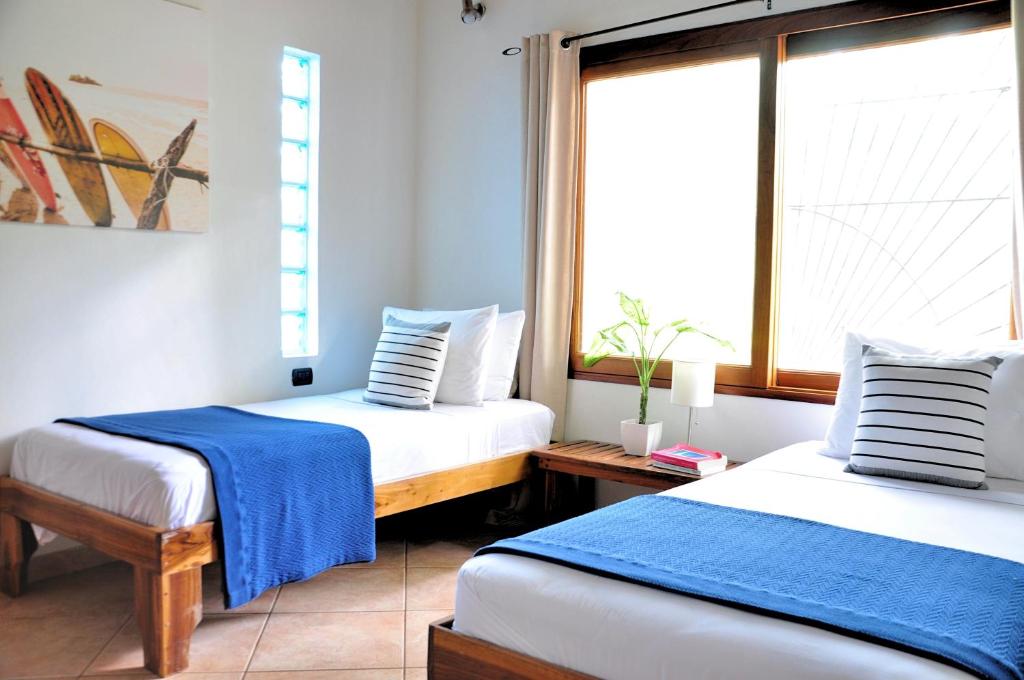 Postel nebo postele na pokoji v ubytování Pazifico Villas