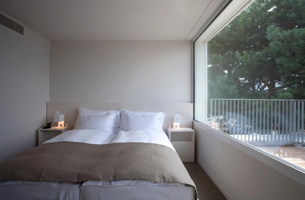 Postel nebo postele na pokoji v ubytování Hotel Lavaux
