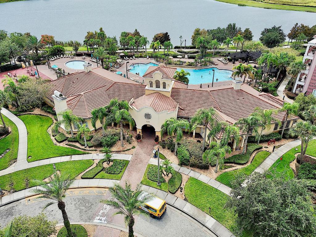 an aerial view of a house with a swimming pool at Vista Cay Luxury 4 bedroom condo (#3117) in Orlando