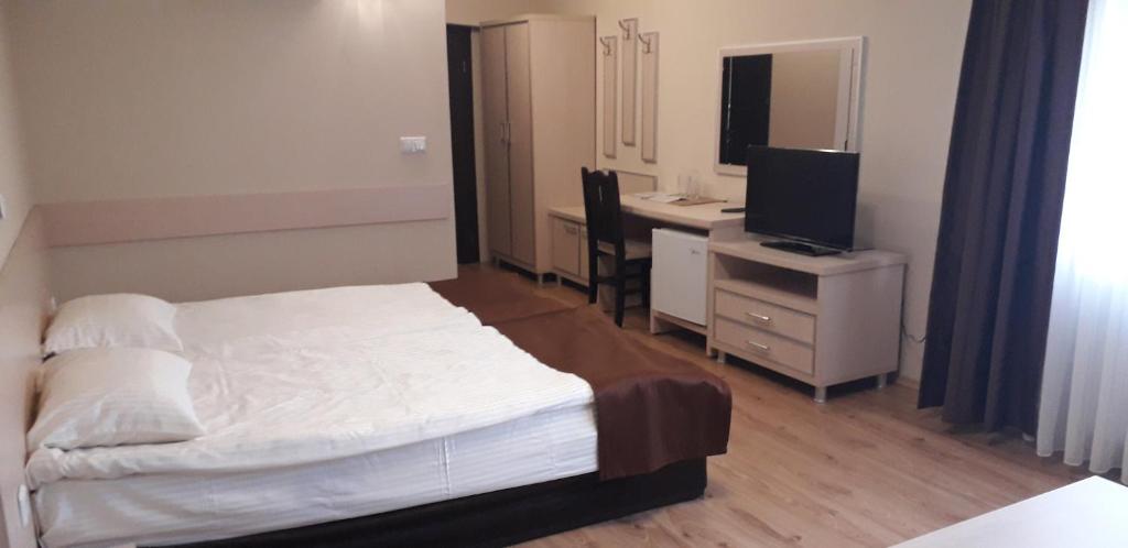 Postel nebo postele na pokoji v ubytování Heat Complex Family Hotel