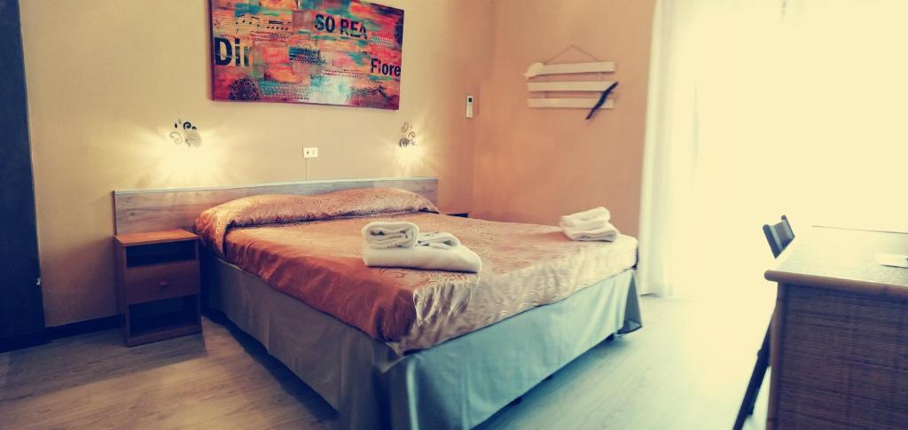 Postel nebo postele na pokoji v ubytování Hotel Eva La Romantica