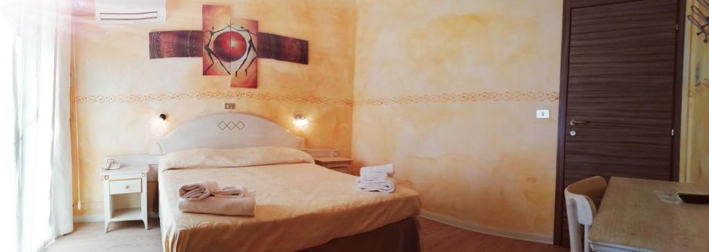 Postel nebo postele na pokoji v ubytování Hotel Eva La Romantica
