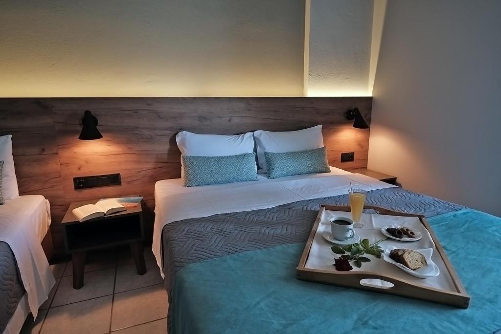 Postel nebo postele na pokoji v ubytování Poledas Apartments