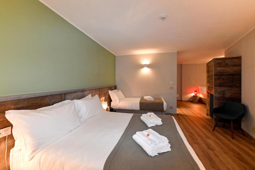 Postel nebo postele na pokoji v ubytování Du Parc Hotel