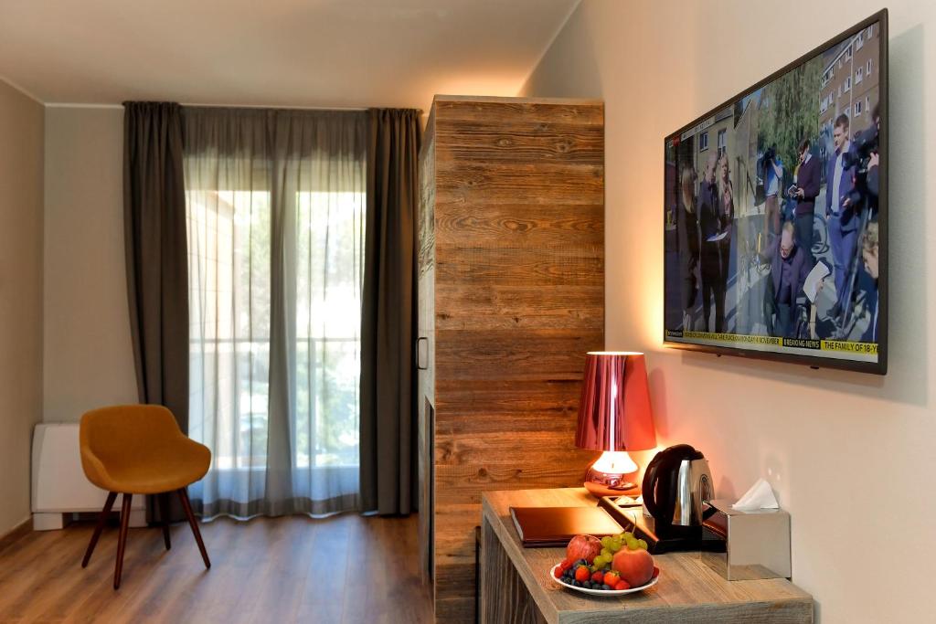 TV a/nebo společenská místnost v ubytování Du Parc Hotel