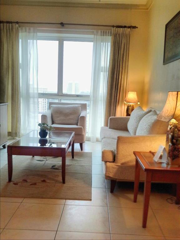 Χώρος καθιστικού στο StayInn Gateway Hotel Apartment