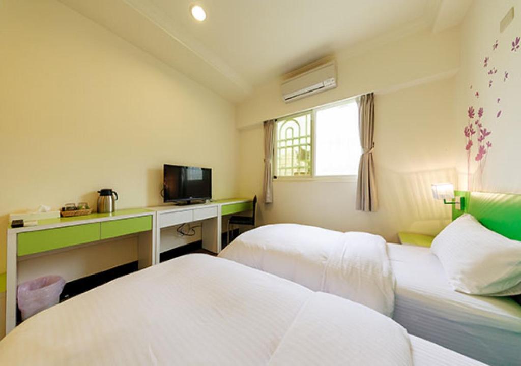 Postel nebo postele na pokoji v ubytování Backpacker B&B