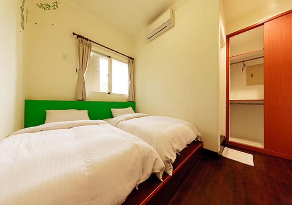 Postel nebo postele na pokoji v ubytování Backpacker B&B