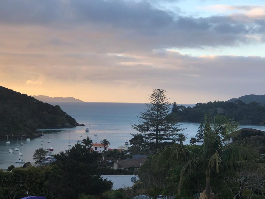 a view of a bay with boats in the water at Harbour View Retreat Mangonui in Mangonui