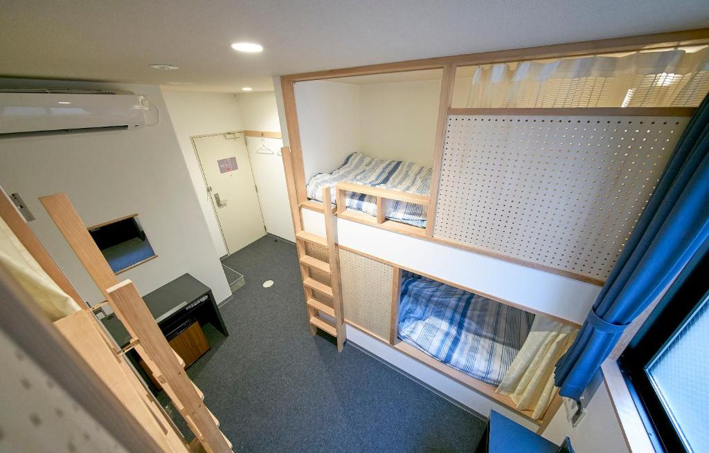 Postel nebo postele na pokoji v ubytování Hostel Takeyado