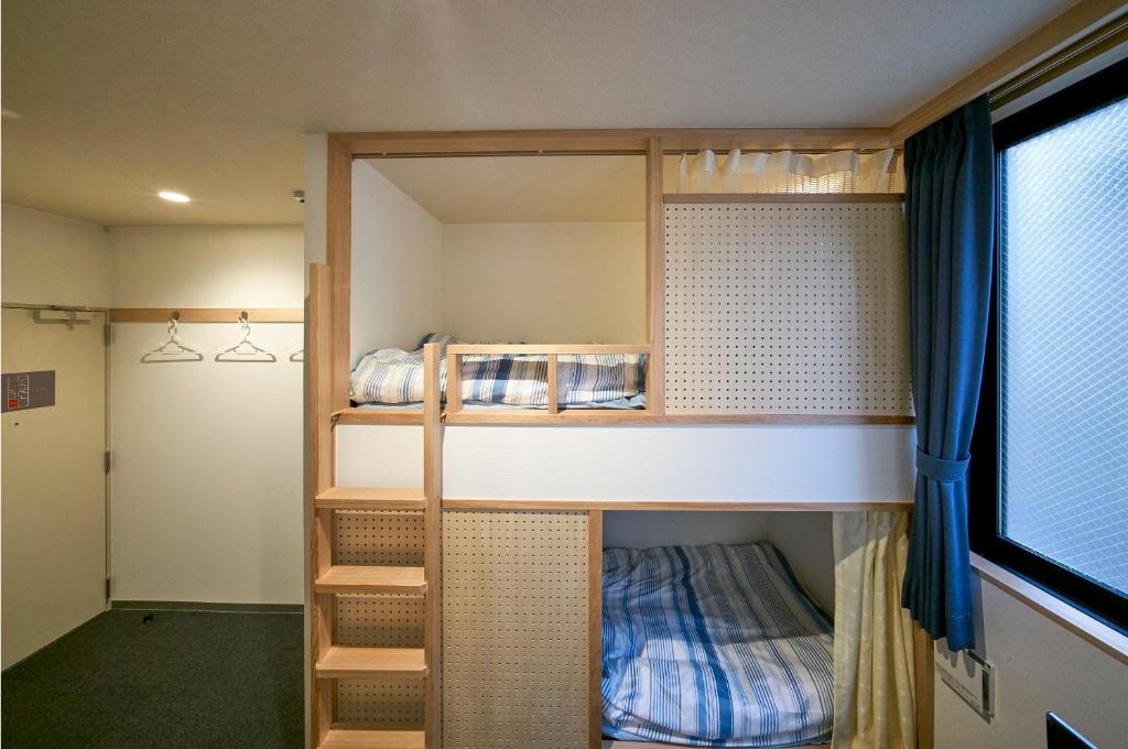 Postel nebo postele na pokoji v ubytování Hostel Takeyado
