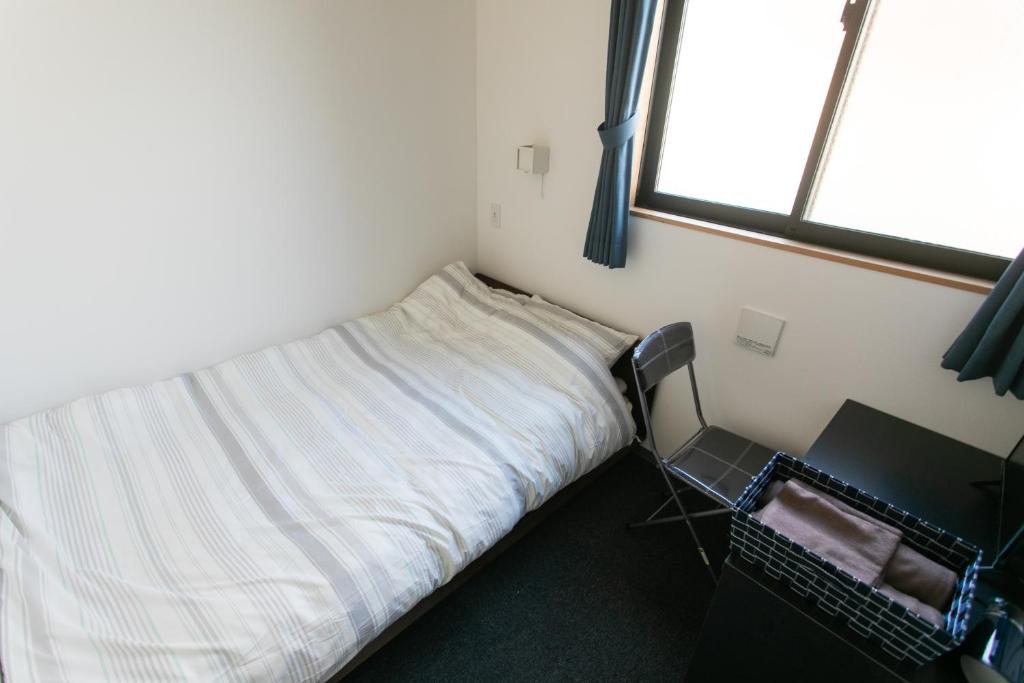 Postel nebo postele na pokoji v ubytování Hostel Takeyado