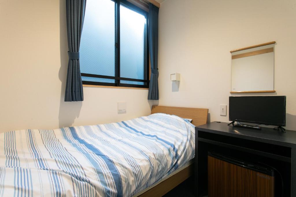 Postel nebo postele na pokoji v ubytování Hostel Takeyado