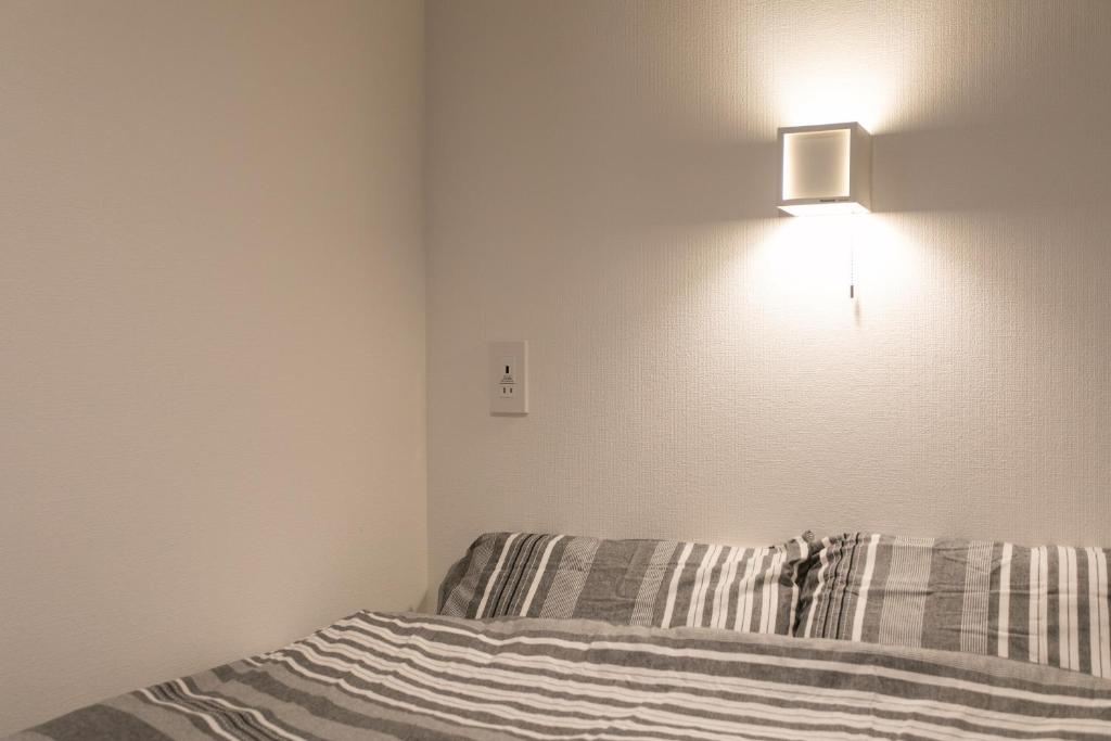 Postel nebo postele na pokoji v ubytování Hostel Takeyado
