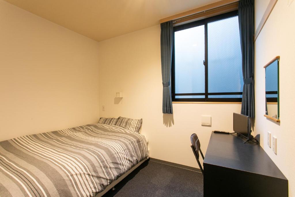 Postel nebo postele na pokoji v ubytování Hostel Takeyado