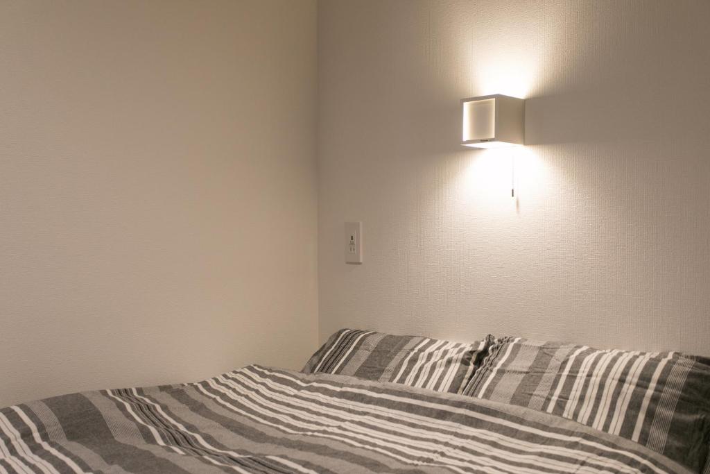 Postel nebo postele na pokoji v ubytování Hostel Takeyado