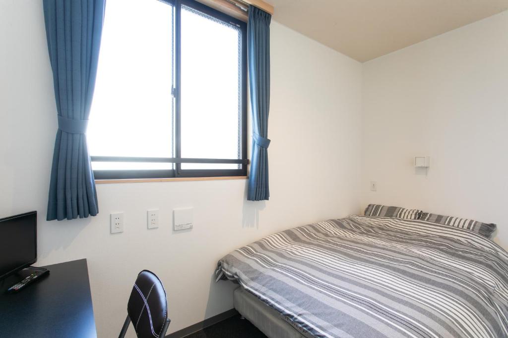 Postel nebo postele na pokoji v ubytování Hostel Takeyado