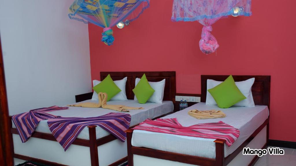 Postel nebo postele na pokoji v ubytování Mango Villa Sigiriya
