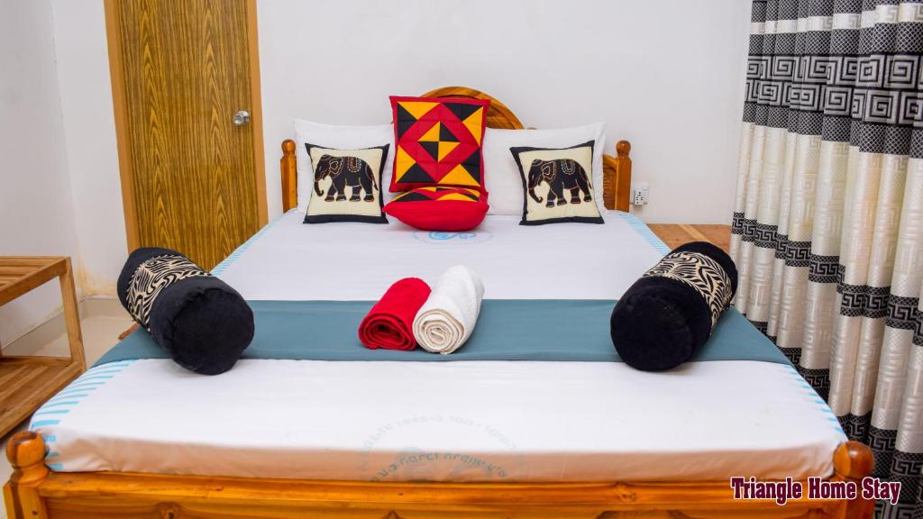 Postel nebo postele na pokoji v ubytování Triangle Home Stay
