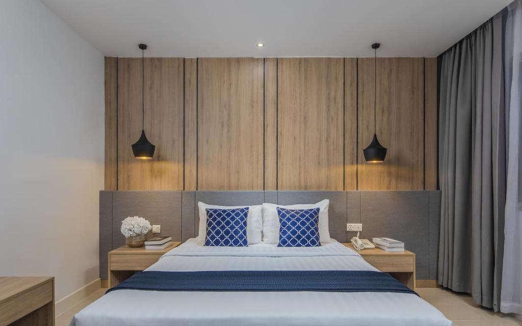 Postel nebo postele na pokoji v ubytování Altos Hotel