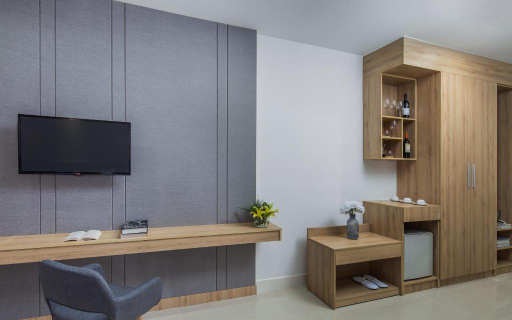 TV a/nebo společenská místnost v ubytování Altos Hotel