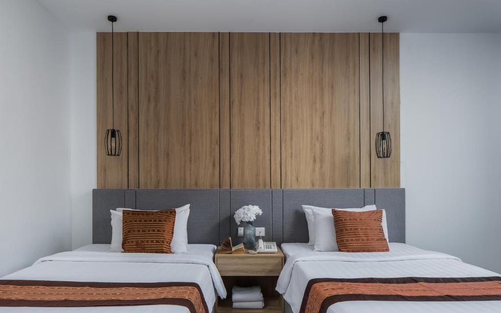 Postel nebo postele na pokoji v ubytování Altos Hotel