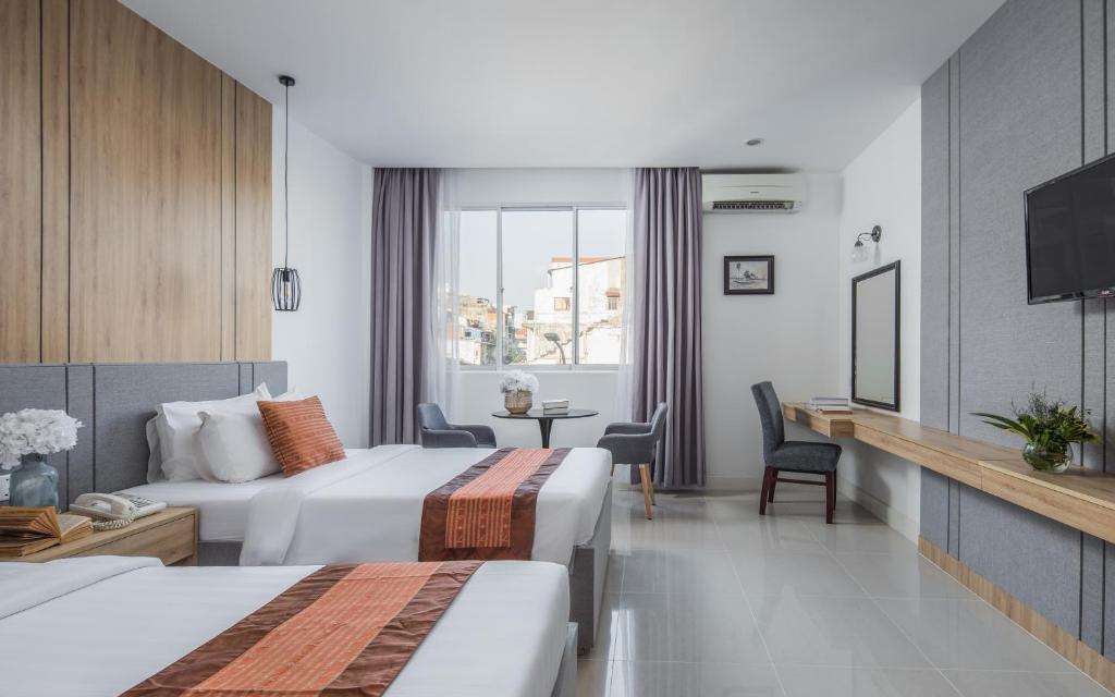 Postel nebo postele na pokoji v ubytování Altos Hotel