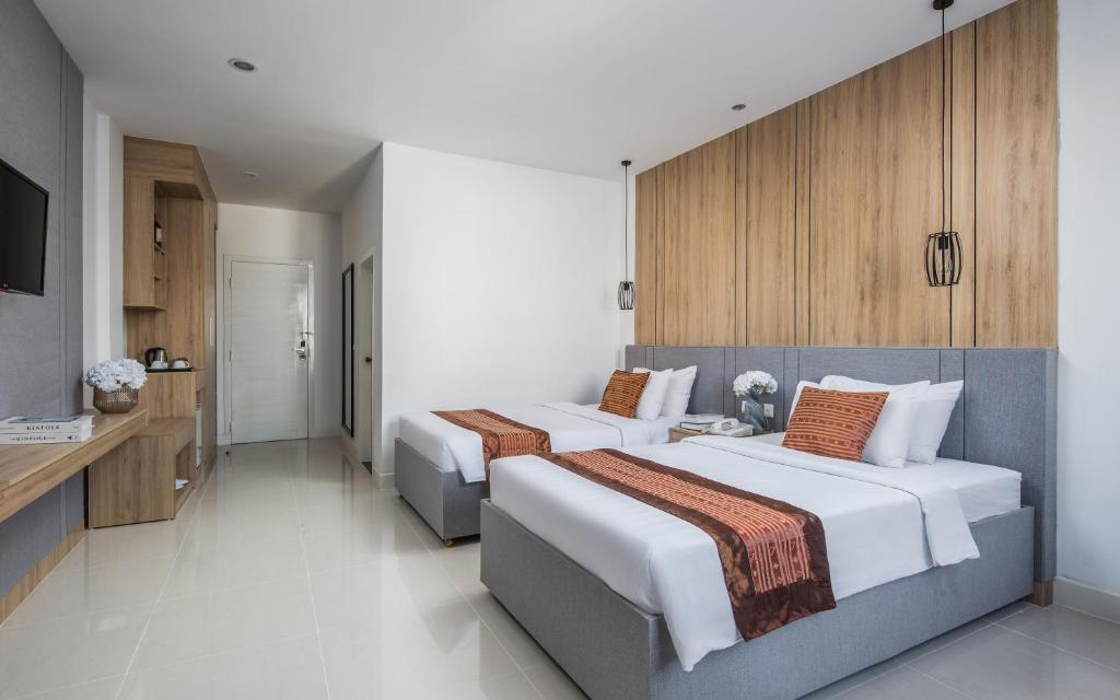 Postel nebo postele na pokoji v ubytování Altos Hotel