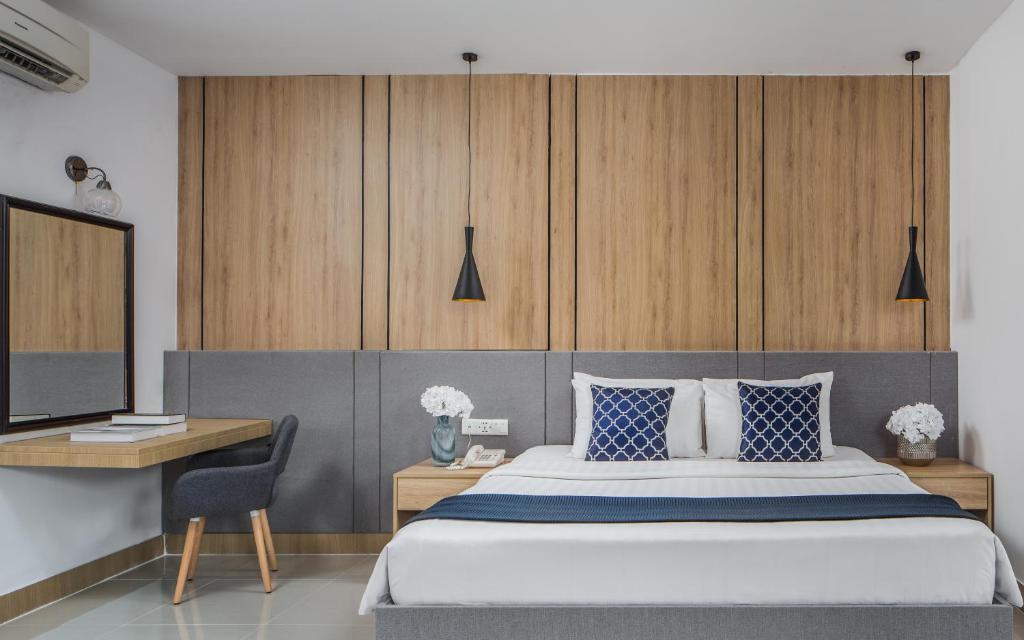 Postel nebo postele na pokoji v ubytování Altos Hotel