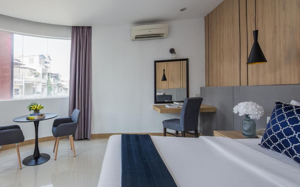 Postel nebo postele na pokoji v ubytování Altos Hotel