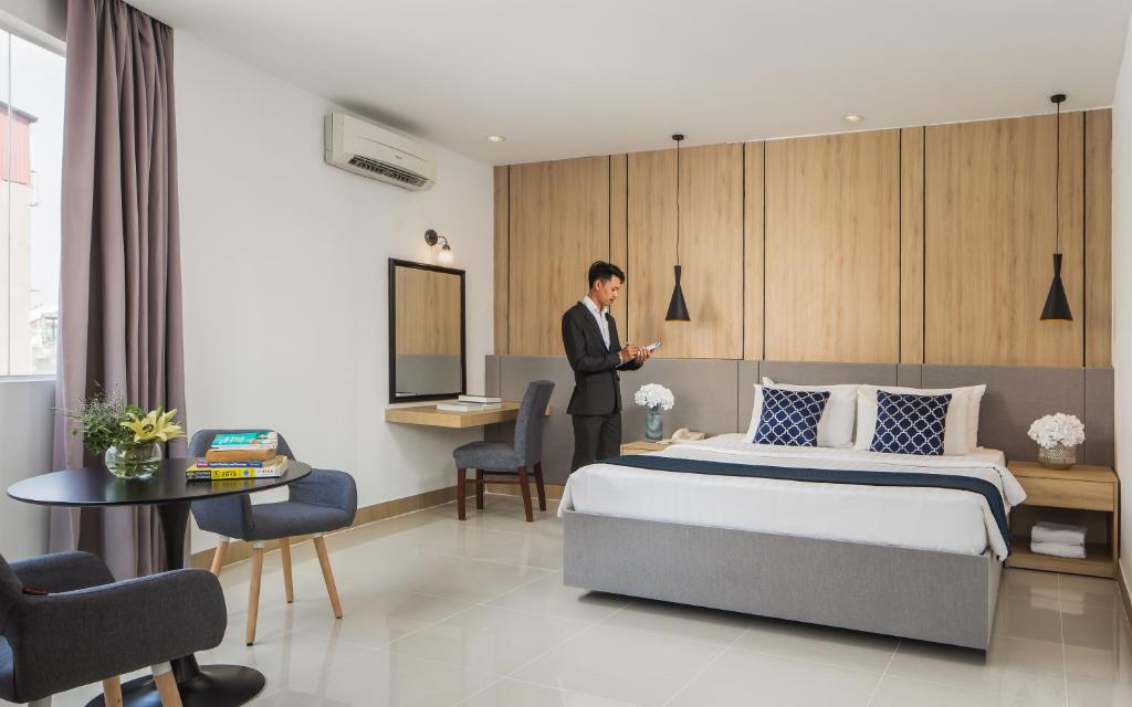 Postel nebo postele na pokoji v ubytování Altos Hotel