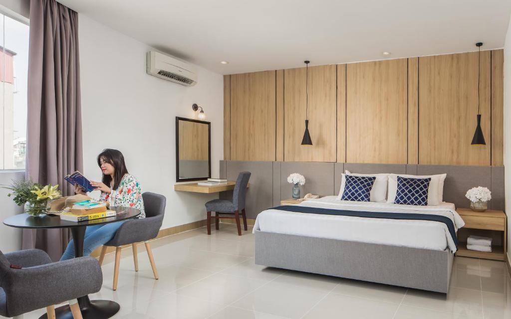 Postel nebo postele na pokoji v ubytování Altos Hotel