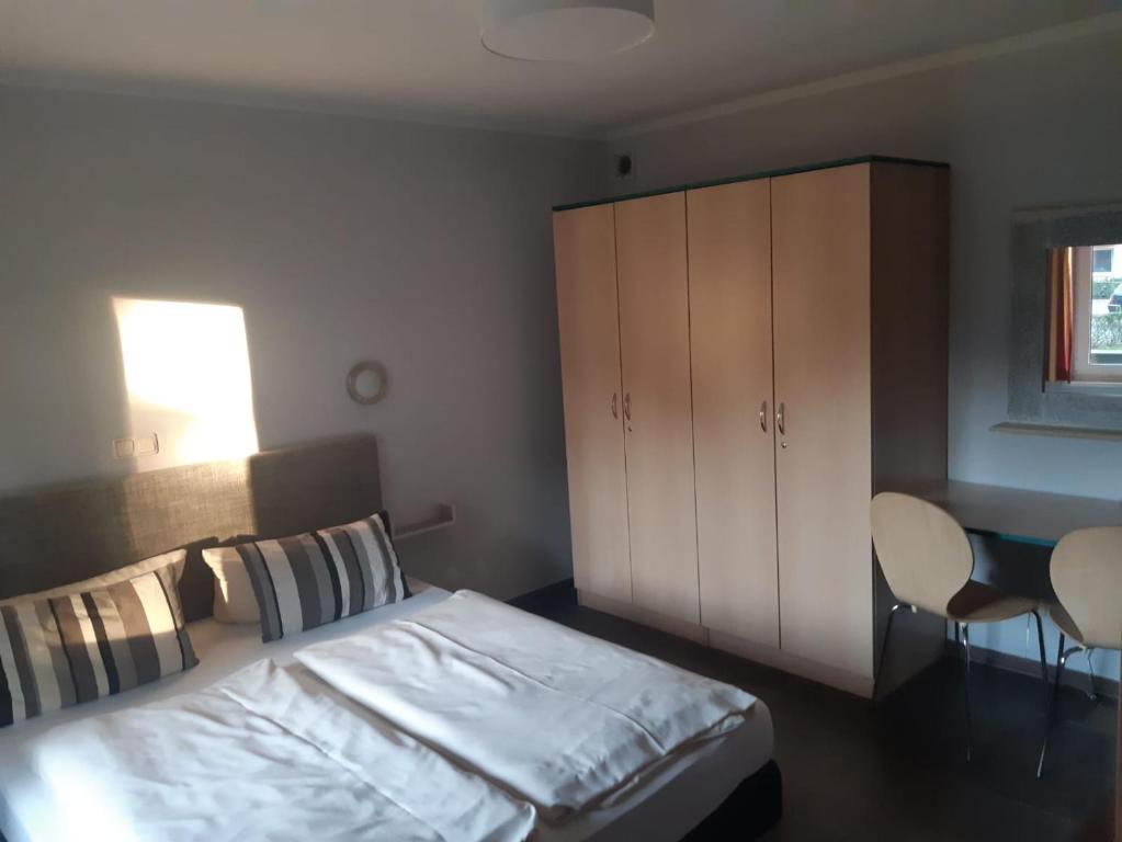 Postel nebo postele na pokoji v ubytování DAS HUDEWALD Hotel & Resort