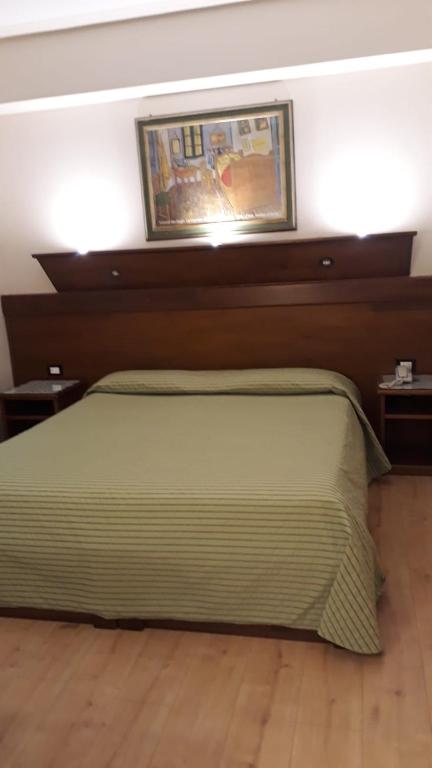 Postel nebo postele na pokoji v ubytování Hotel Lago Verde