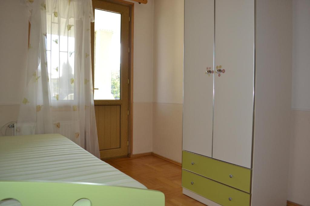 Postel nebo postele na pokoji v ubytování Royal Telavi