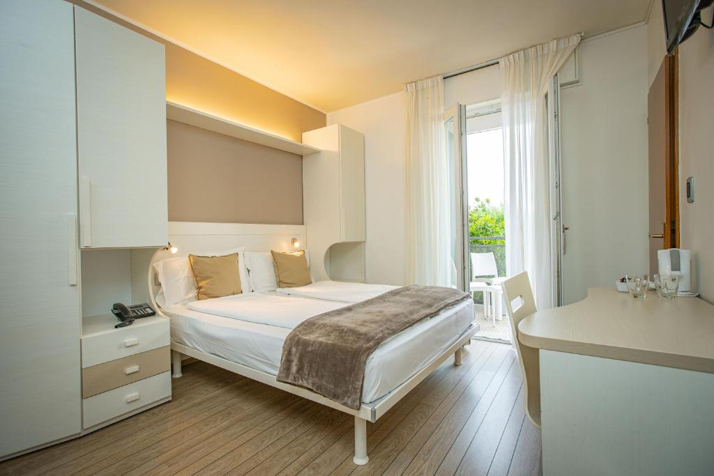 Postel nebo postele na pokoji v ubytování Hotel Villa Alberta