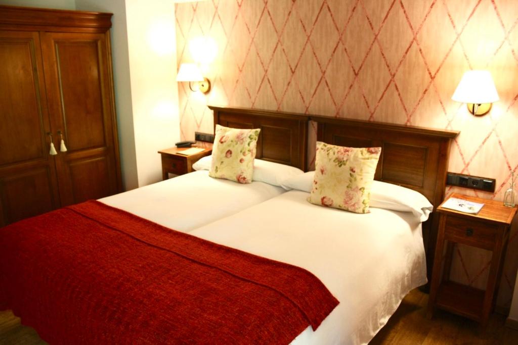 Postel nebo postele na pokoji v ubytování Hotel Casa Arcas