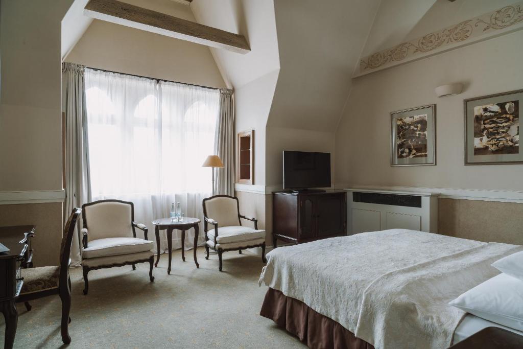 Posteľ alebo postele v izbe v ubytovaní Art Hotel