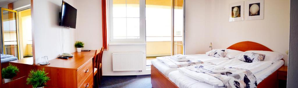 Voodi või voodid majutusasutuse Hotel S-centrum toas